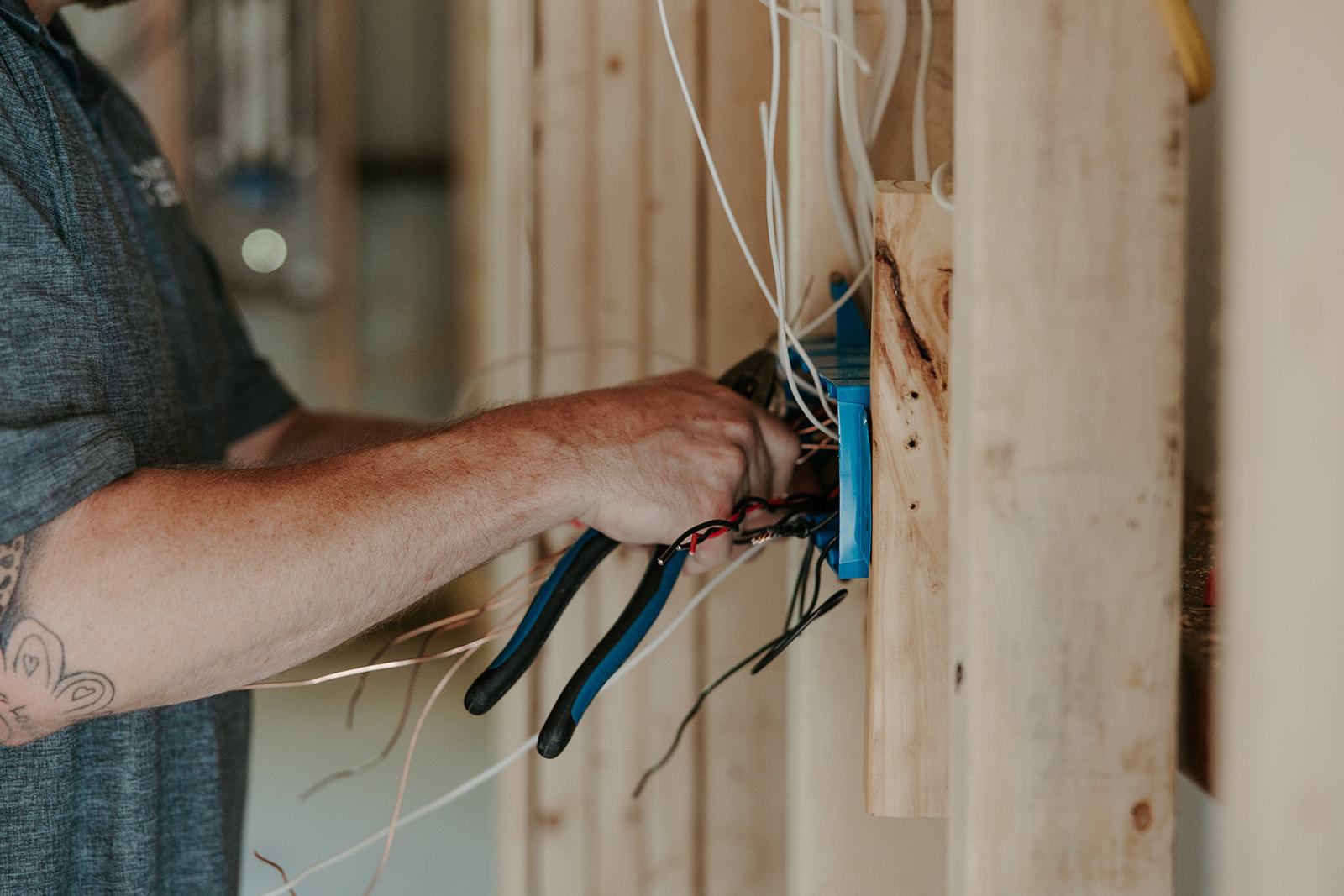 Electrician Working on Wiring for Home