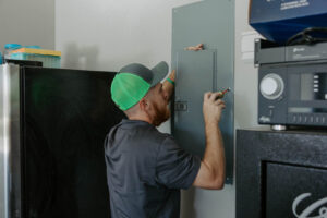 Electrician working on Fuse box