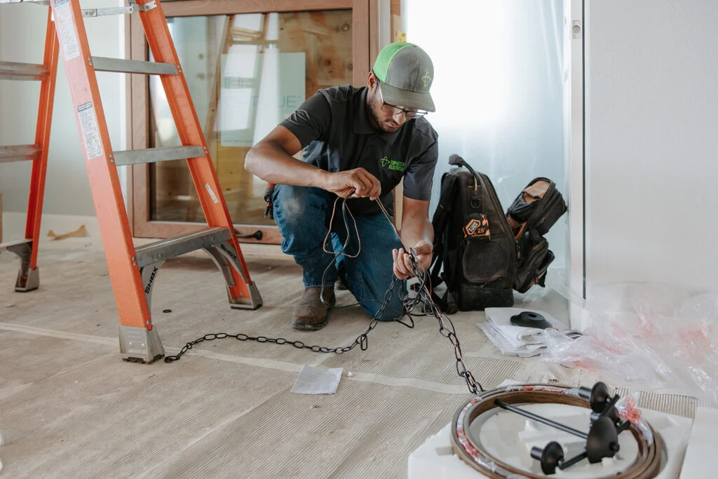 Electrician working on wiring for lights 1
