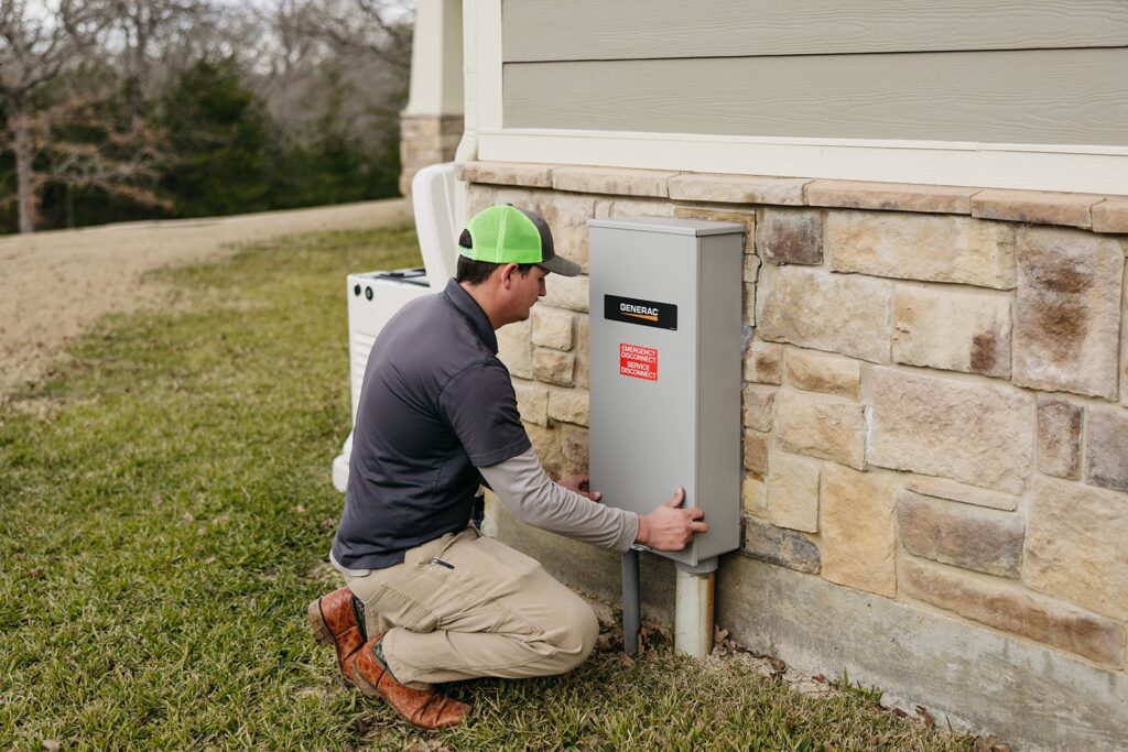 Image of an electrician installing outdoor lighting for Top Notch Electrician, highlighting electrical installation services.