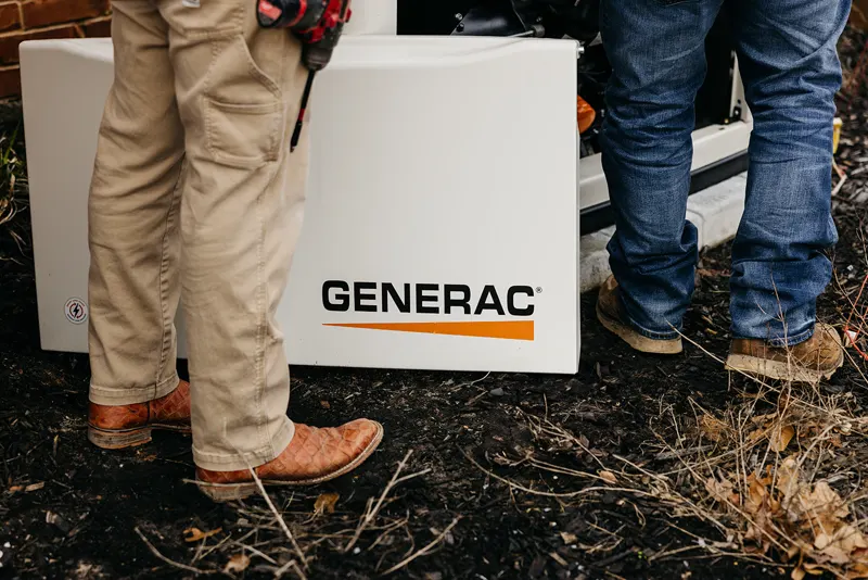 Top Notch Electrician technicians working on a Generac standby generator in North Texas